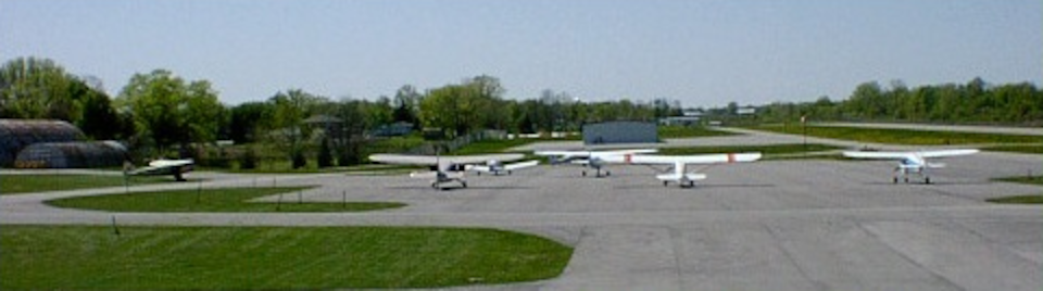 Planes parked in tie-down area.